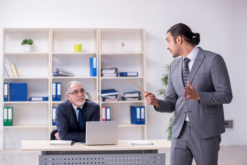 Old and young businessmen in business meeting concept