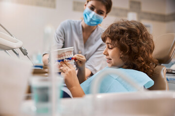 Teeth-brushing skills of a young patient in dental clinic © Svitlana