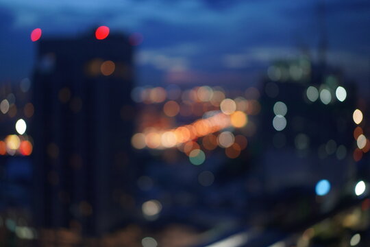 Defocused Image Of Illuminated City At Night
