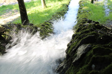 water flowing into a lake 