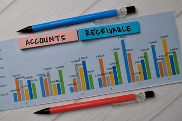 Accounts Receivable write on sticky notes with graphic on the paper isolated on office desk.