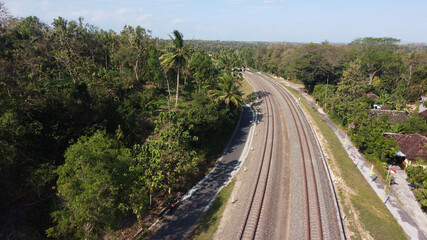 Fototapeta na wymiar aerial view of railroad tracks across the countryside