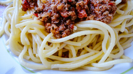 Spaghetti Bolognese with minced beef in the white plate