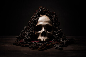 Still life of human skull that died for a long times ,concept of horror or thriller movies of scary crime scene ,Halloween theme, visual art