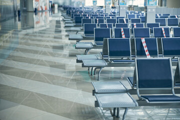 Empty blue seats at the airport in waiting lounge