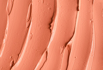 Red cosmetic clay (alginate facial mask, face cream, body wrap) texture close up, selective focus....
