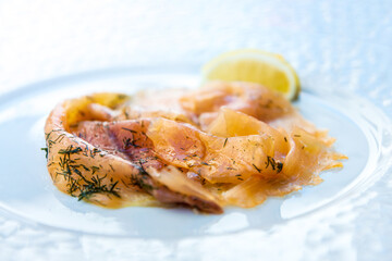 grilled salmon and lemon - french cuisine dish with tomato and salmon