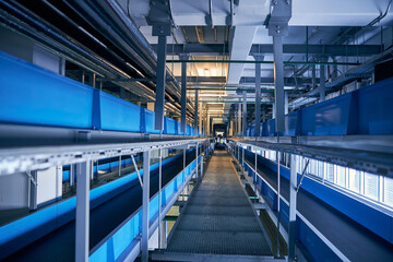 Obraz premium Photo of conveyor belts system for luggage transporting
