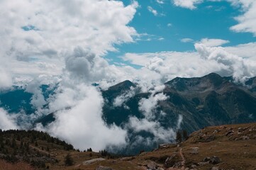 Cloudscape in the Alps with mountains in background (Peio, Trentino, Italy, Europe)