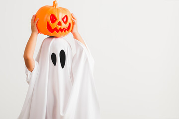 Funny Halloween Kid Concept, little cute child with white dressed costume halloween ghost scary he...