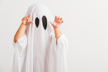 Funny Halloween Kid Concept, little cute child with white dressed costume halloween ghost scary,...