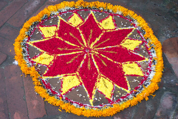 Red and yellow flower on the Door step to welcome Guests