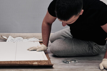 Obraz premium Furniture assembly process. Installation of fasteners and accessories. Do it yourself.