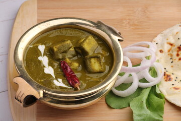 Palak paneer or Spinach and Cottage cheese curry is a healthy main course recipe in India, served with Naan.