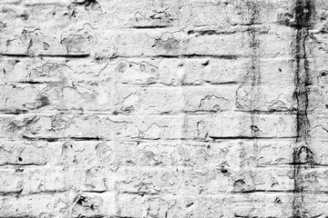Texture of a brick wall with cracks and scratches which can be used as a background
