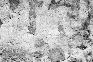 Texture of a concrete wall with cracks and scratches which can be used as a background