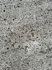 Facade with natural imperfections and holes as simple surface texture background