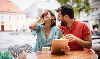 Beautiful couple in love having fun on a date in a cafe