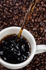 Cup of coffee and coffee beans