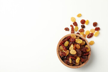 Bowl with raisins on white background, top view