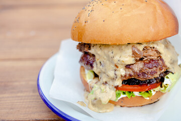 beef burger with mushrooms, tomato, cheese