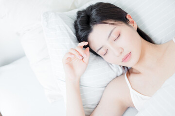 Asian women sleeping in bed