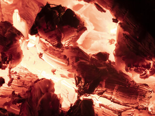 Macro shot of red hot coals in a fireplace