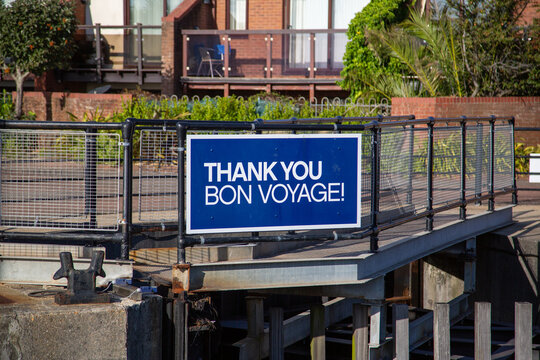 a sign on the side of a marina reading thank you Bon Voyage