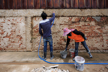 construction worker using a trowel