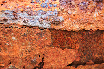 The iron is rusty, indented.