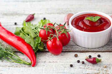 ingredients of tomato sauce. Products for preparing ketchup on white wooden background