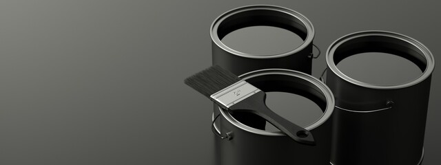 Cans of black paint on dark stage.