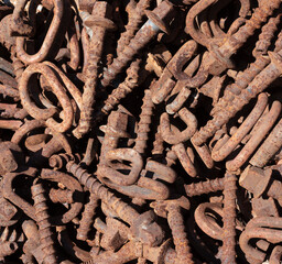Old rusty discarded metal parts pile