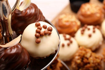 Catering sweets, closeup of various kinds of cakes on event or wedding reception.