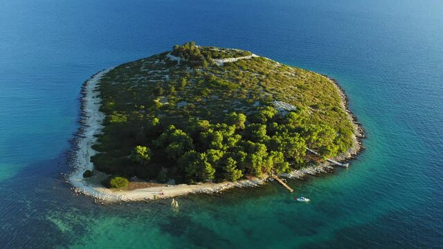 Aerial view of an islet with a  pine forest near Pakostane, Adriatic coast in Croatia