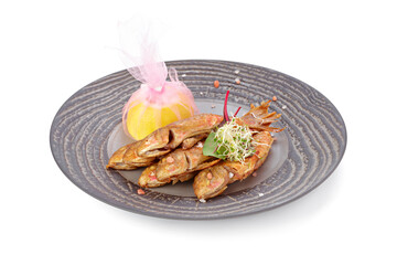 Fried fish on plate isolated on white