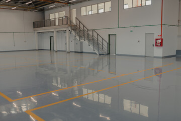 Epoxy and waxed flooring with colorful signage.