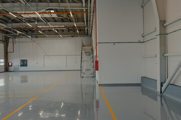 Epoxy and waxed flooring with colorful signage.