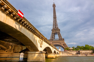 Iena Bridge in the Sun and Eiffel Tower in Cloudy Weather