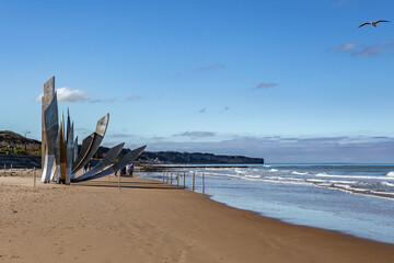 The omaha beach in Normandy, France, on a sunny day.