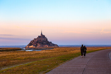 Mont-Saint-Michel and its Bay at sunset, in Normandy, France.