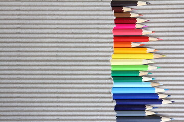 Color pencils on brown corrugated cardboard