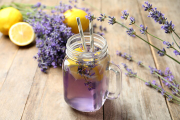 Obraz na płótnie Canvas Fresh delicious lemonade with lavender in masson jar on wooden table