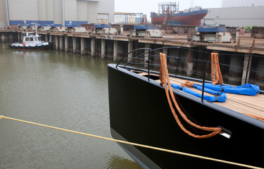 Super sailing yacht in a dock. Ship building industry. Shipyard. Building superyachts.