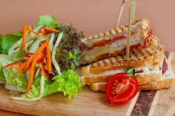 Sandwich With Cheese and Sausages, Serviced With Vegetables