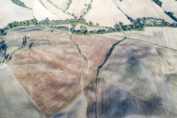 Aerial view of the sunrise in the valley of the orc, the sun just arose, the countryside in Tuscany