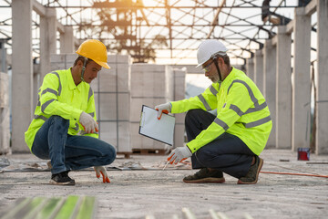 Quality inspection of cement floors by supervisor engineers and workers
