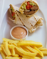 Meatball Wrap With Sause And Fried Potatoes