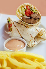 Meatball Wrap With Sause And Fried Potatoes