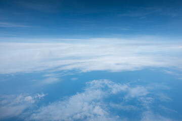 Naklejka na ściany i meble Cloud and blue sky from the airplane window
